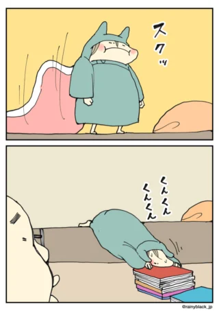 布団から起きて積まれた本の匂いを嗅ぐ人物