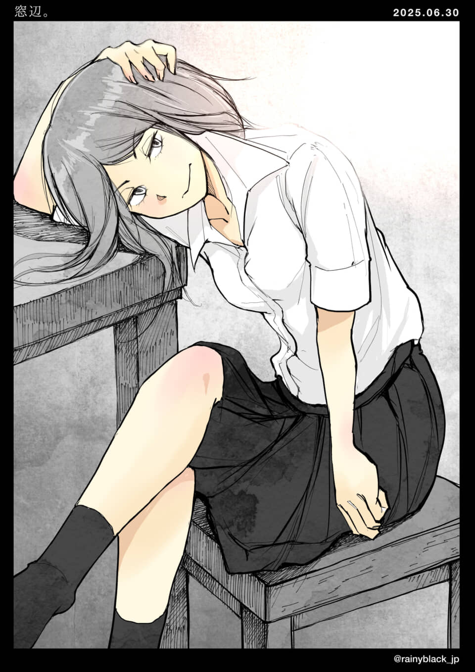 机に寄りかかる女子学生。
