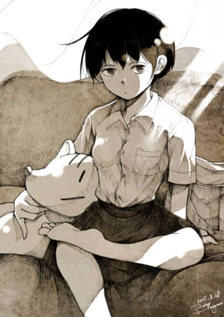 女の子がぬいぐるみと座る。