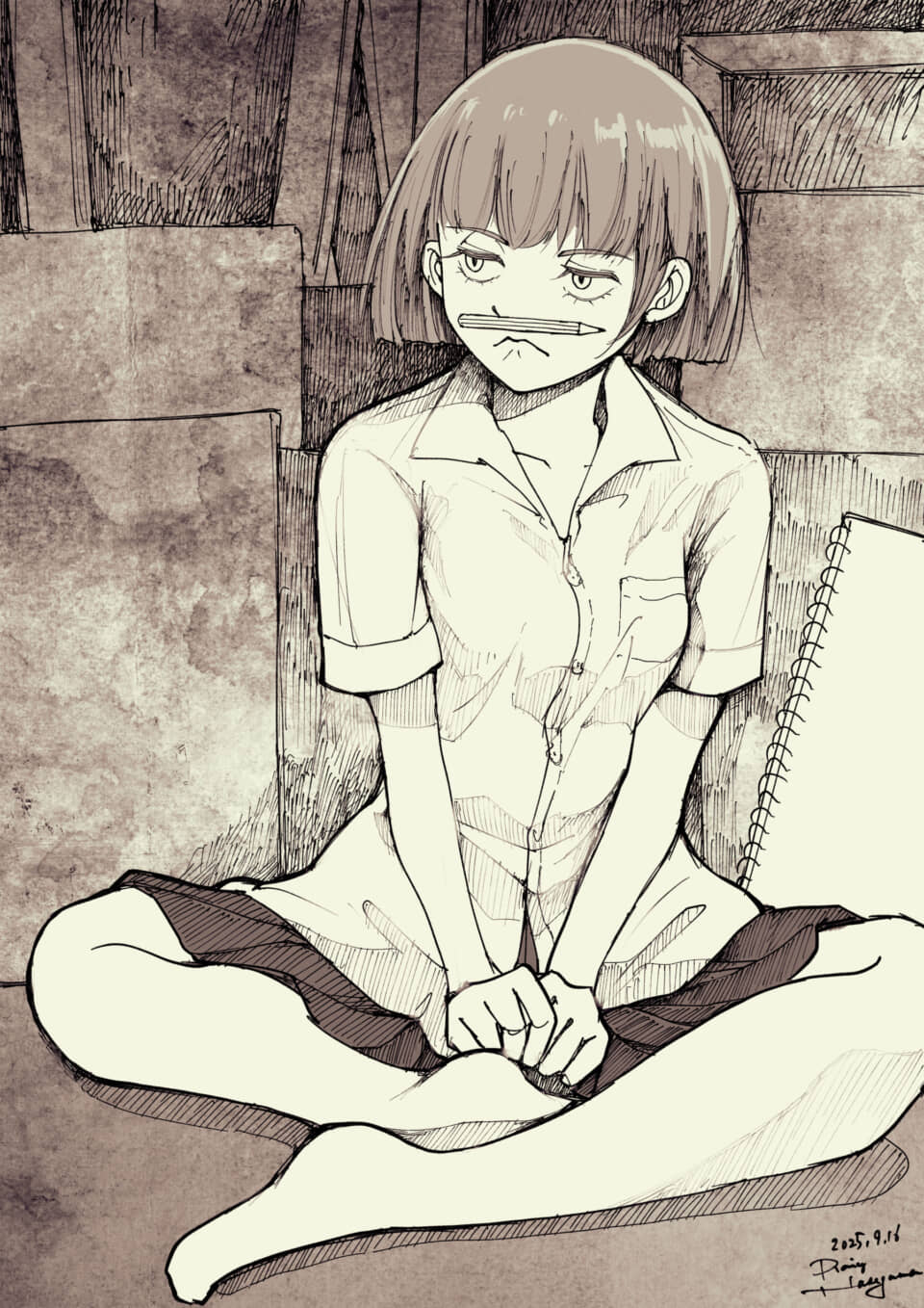 女の子が鉛筆を口に挟む。