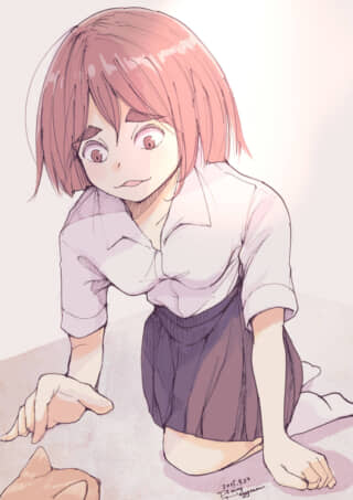 女の子が猫に興味津々で見つめる。