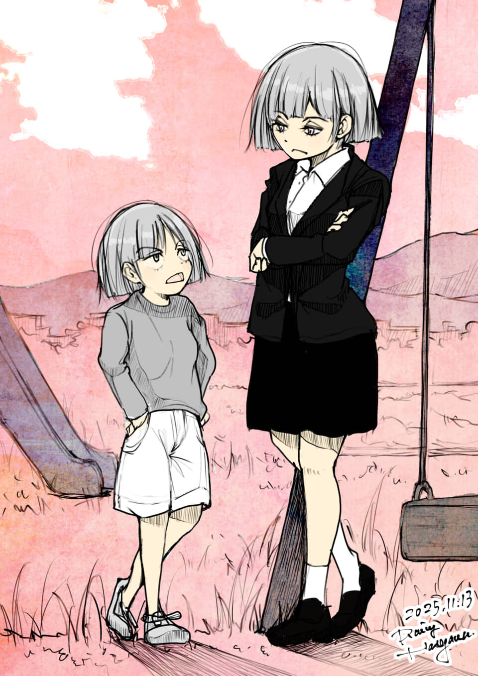 ブランコに立つ兄妹。