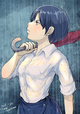 雨の中、傘を持つ女性の横顔。