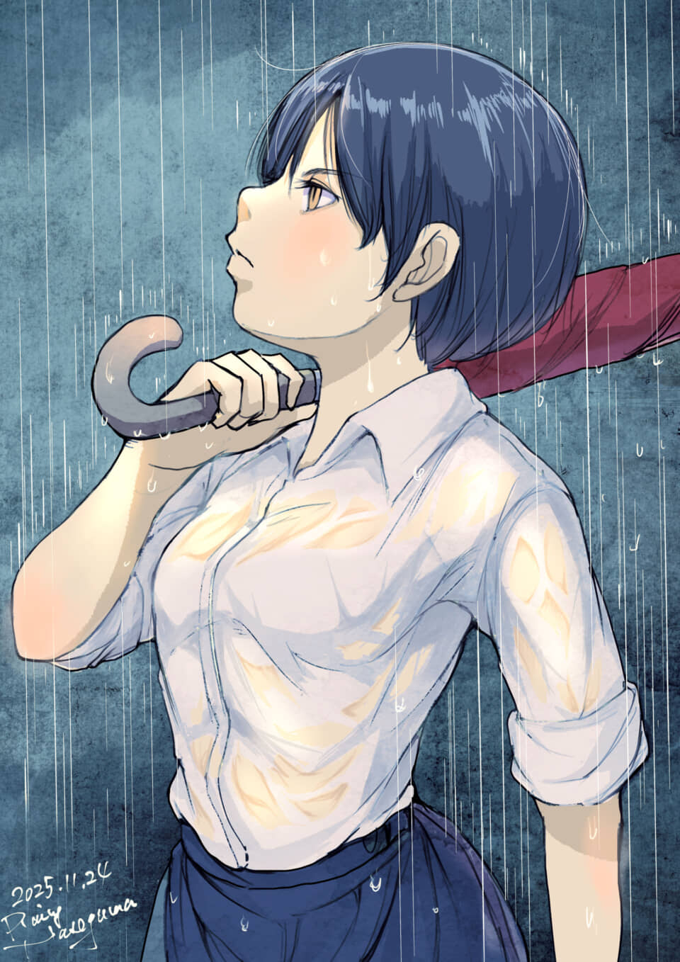 雨の中、傘を持つ女性の横顔。