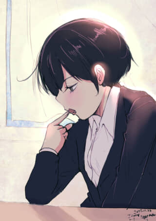 女子学生が何かを食べている。