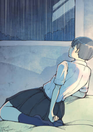 窓から雨を眺める女子学生