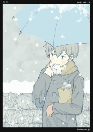 雪の中で傘をさす少年