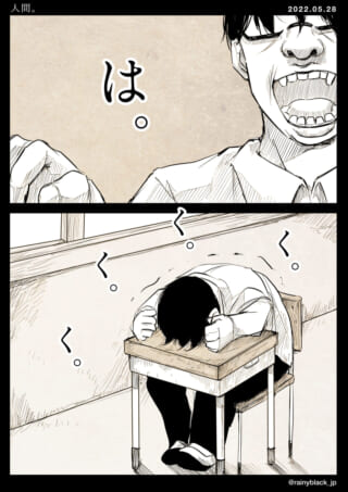 机にうつ伏せで落ち込む人